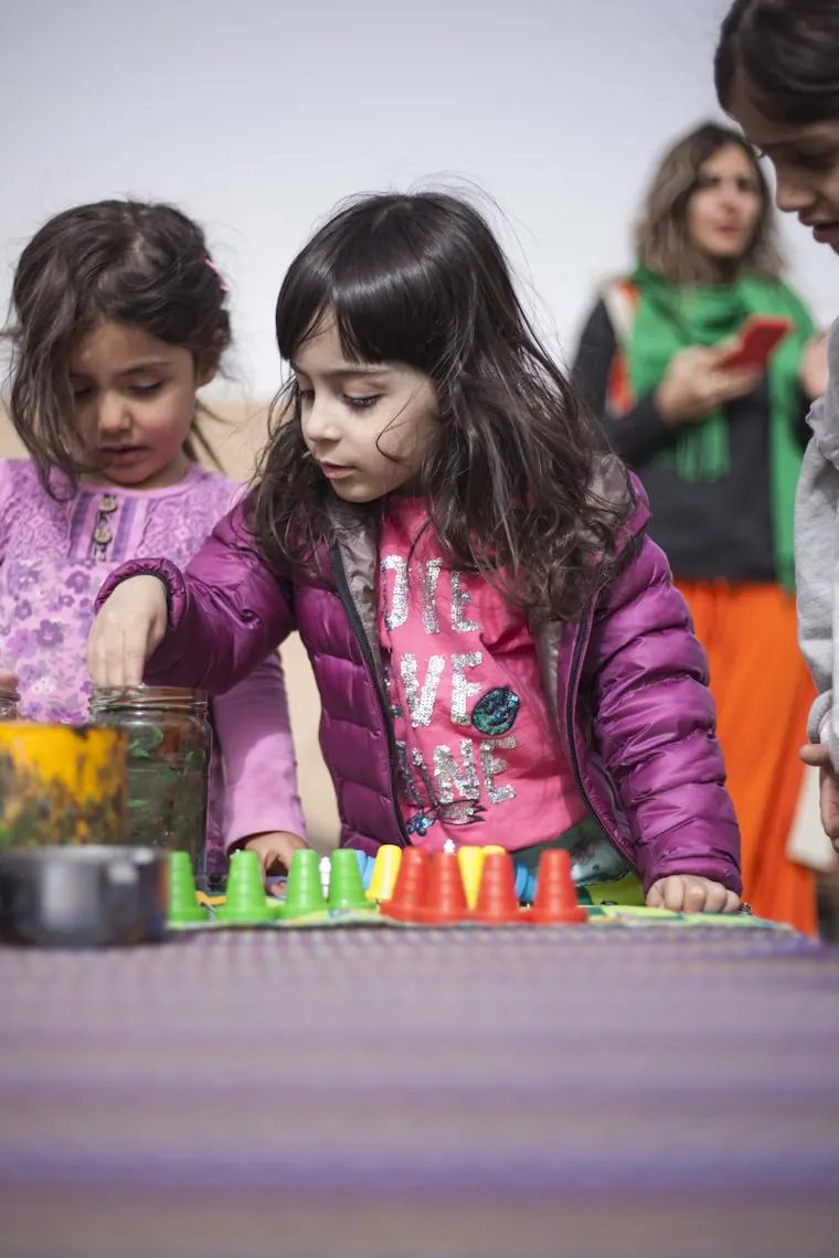 Two children playing together with toys